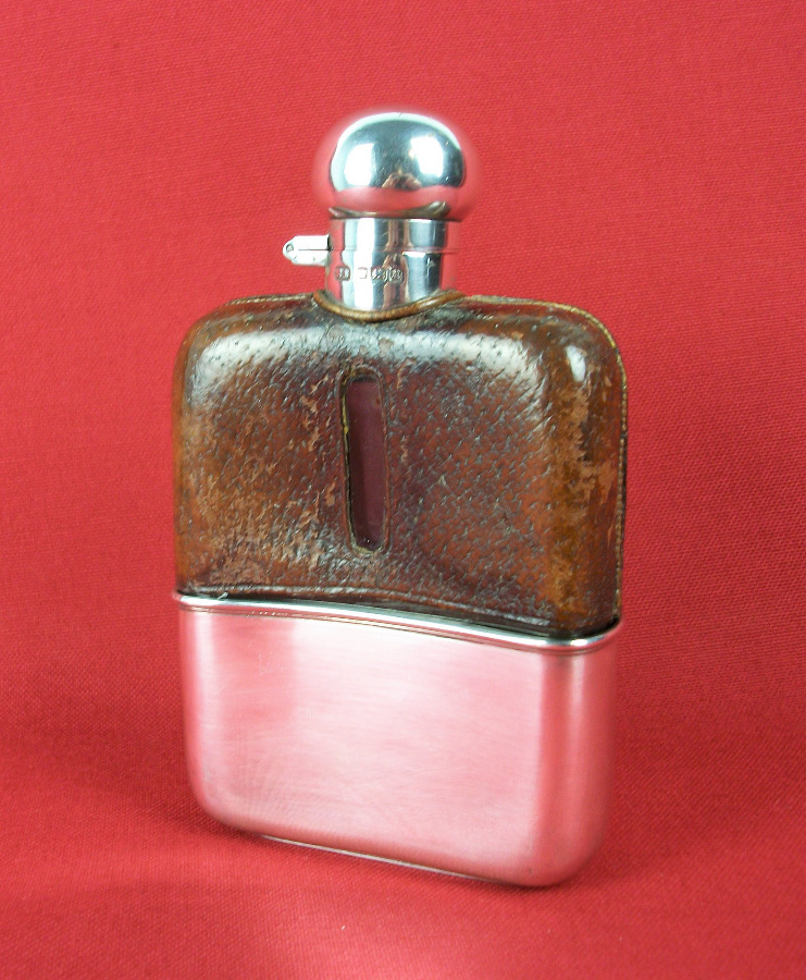 silver and leather bound hip flask